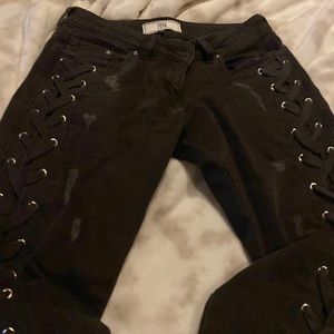 Great looking black jeans with a tie down both legs